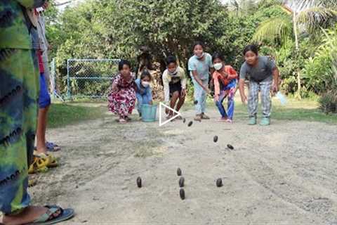 Cambodian traditional game with forest tamarind seeds for Khmer New Year - Fun outdoor game