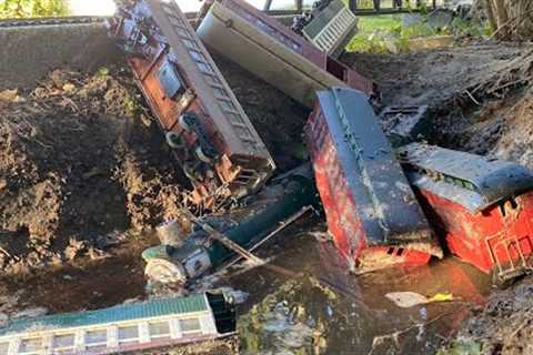 PASSENGER TRAIN CRASHES INTO MUD